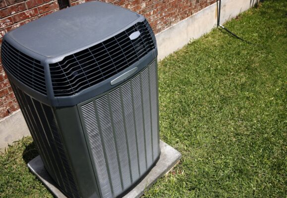 a brand new air conditioning unit outside of a residential home
